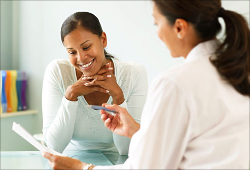 getty_rm_photo_of_therapist_talking_over_paper_with_woman